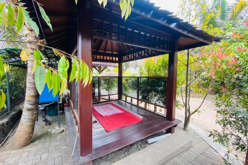 Rumah Kayu Pinggir Kali Prigen RedPartner, Pasuruan