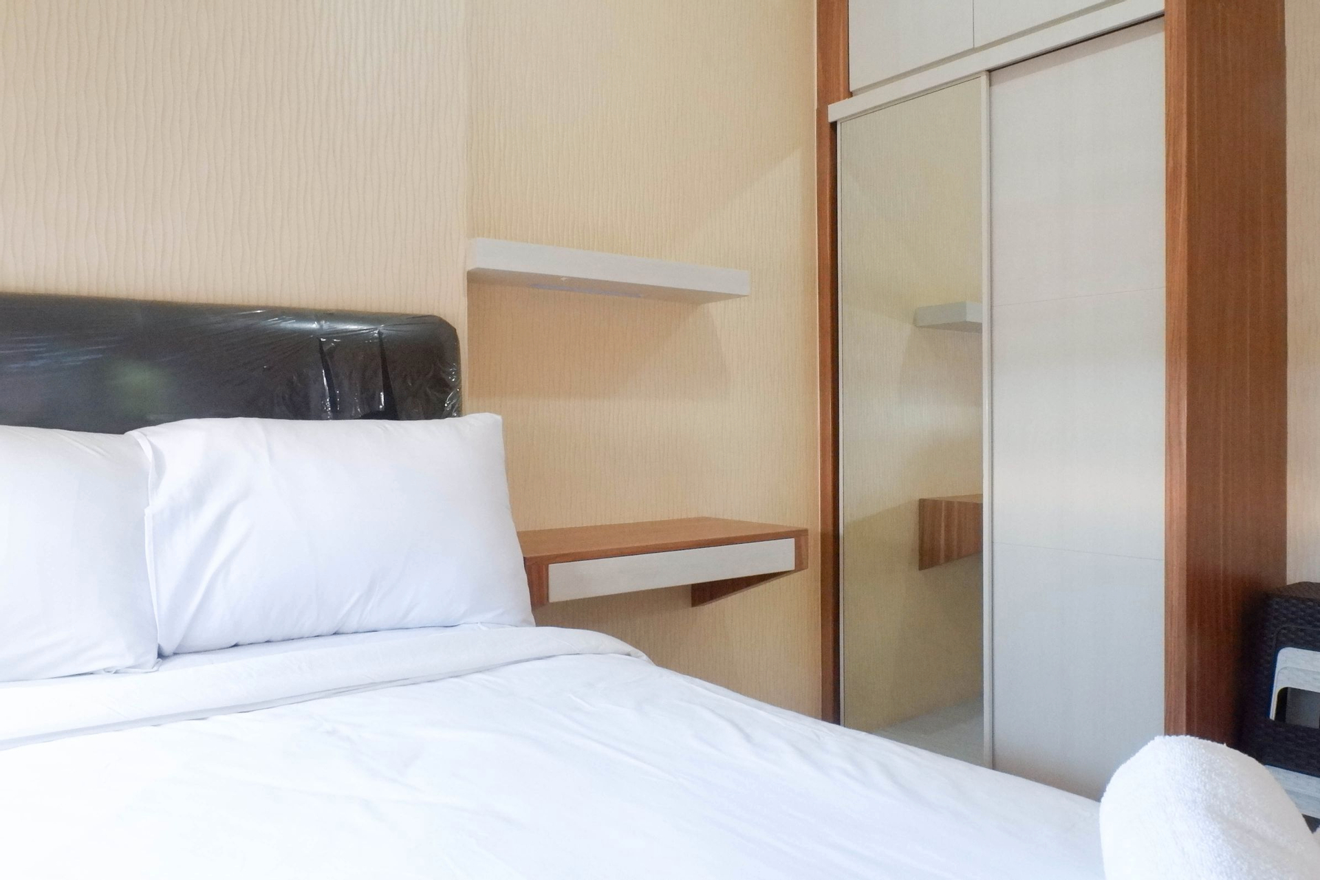Bedroom 3, Spacious 2BR with Exquisite View at Puncak Dharmahusada Apartment By Travelio, Surabaya