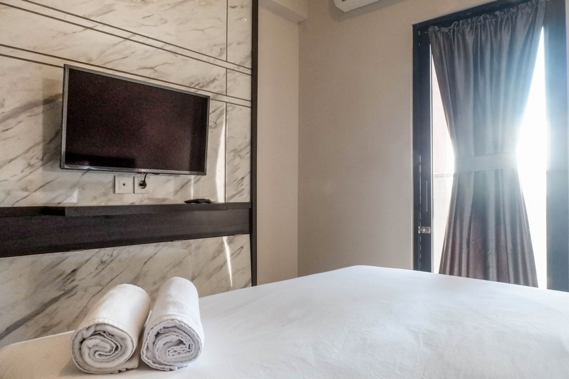 Bedroom 4, Best Living Studio Apartment at Amega Crown Residence By Travelio, Surabaya