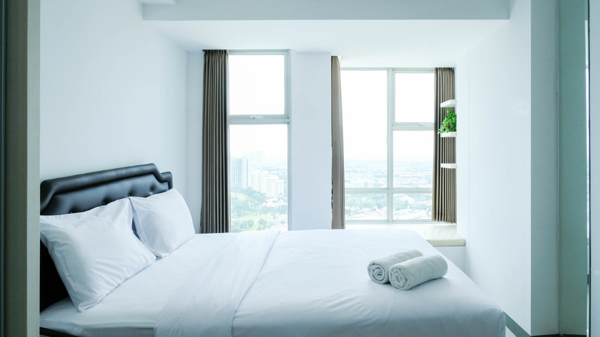 Bedroom 1, Cozy Living Studio Connected to Mall at Supermall Mansion Apartment By Travelio, Surabaya