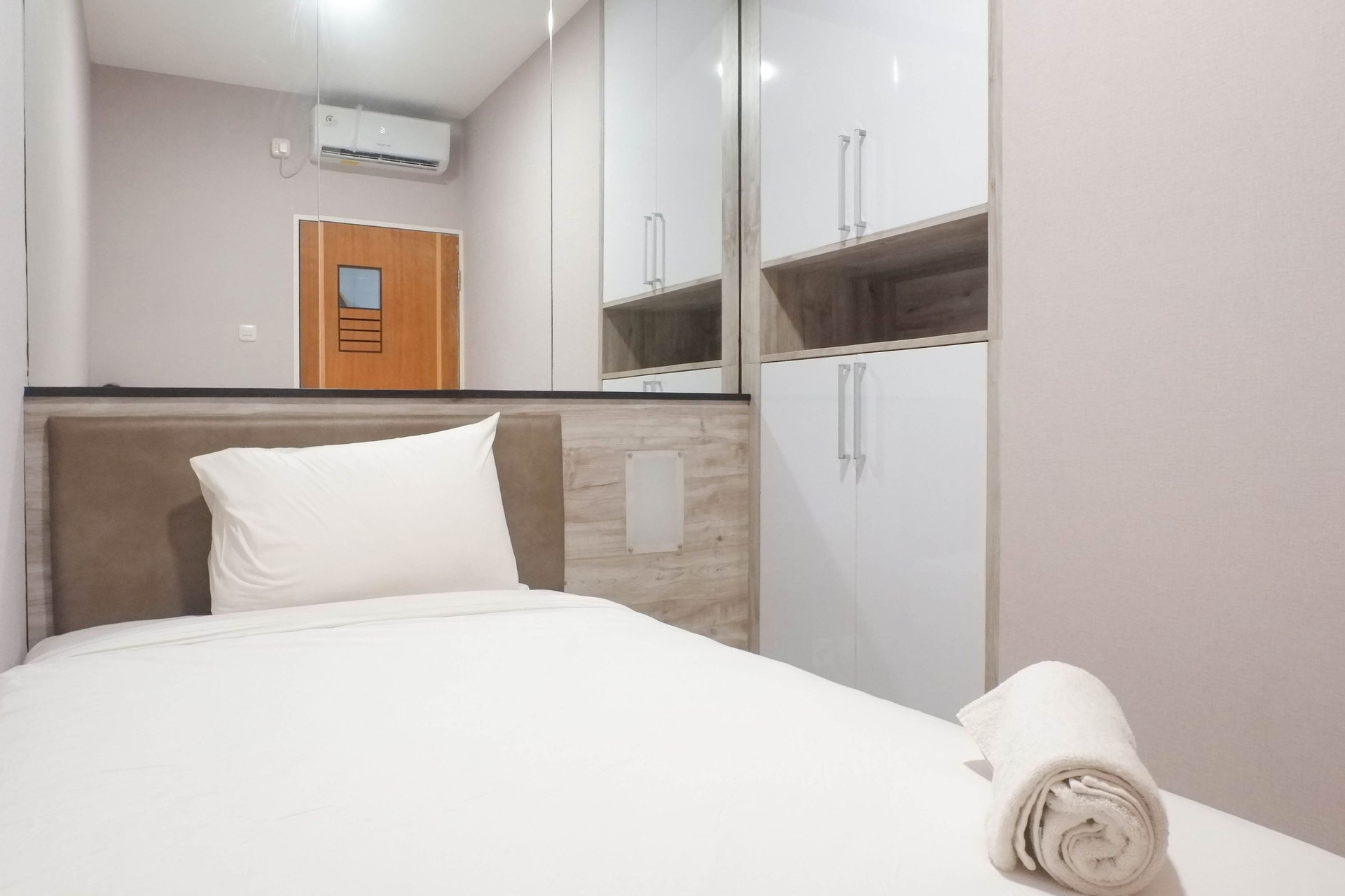 Bedroom 2, Stylish Pool View 2BR Apartment at Puncak Bukit Golf By Travelio, Surabaya
