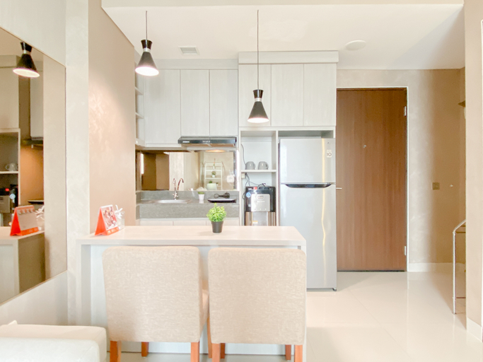 Living Room 2, Bright and Homey 2BR at Apartment Transpark Cibubur By Travelio, Depok