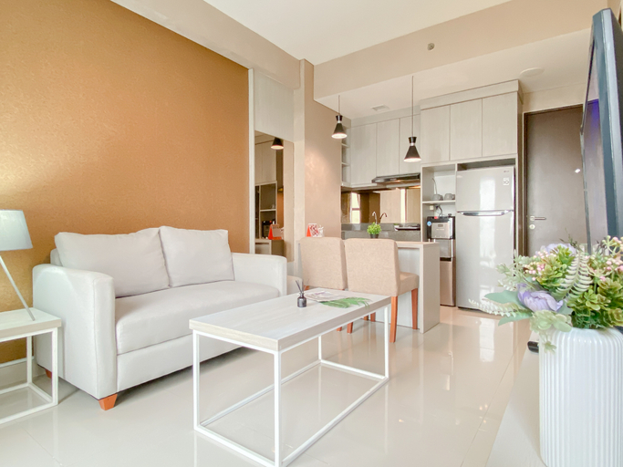Living Room 4, Bright and Homey 2BR at Apartment Transpark Cibubur By Travelio, Depok