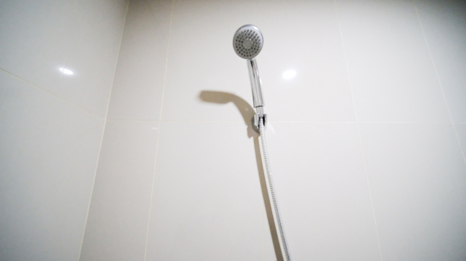 Bathroom 3, Good Choice and Spacious 2BR at Grand Dharmahusada Lagoon Apartment By Travelio, Surabaya