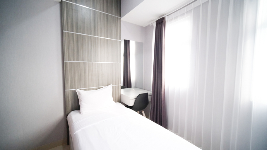 Bedroom 2, Good Choice and Spacious 2BR at Grand Dharmahusada Lagoon Apartment By Travelio, Surabaya