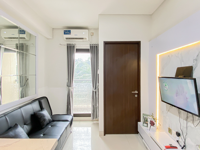 Living Room 2, Refined and Bright 2BR at Apartment Transpark Cibubur By Travelio, Depok