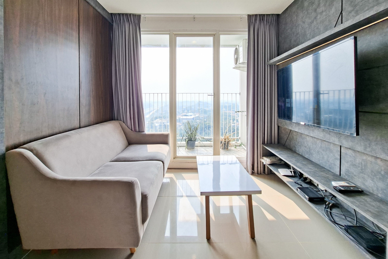 Living Room 5, Bright and Convenient 2BR at Apartment Tuscany Residence By Travelio, South Tangerang