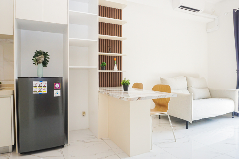 Living Room 3, Stunning Comfy 2BR at Sky House BSD Apartment By Travelio, South Tangerang
