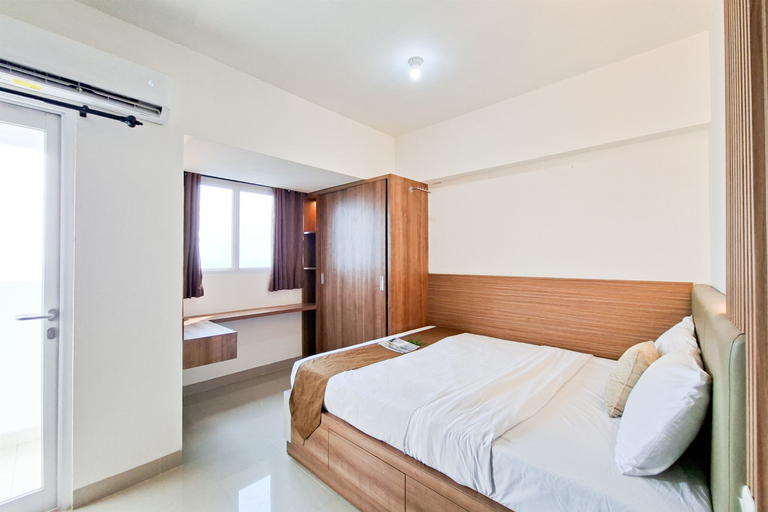 Bedroom 3, Bright and Warm Studio Room at Apartment Cisauk Point By Travelio, Tangerang
