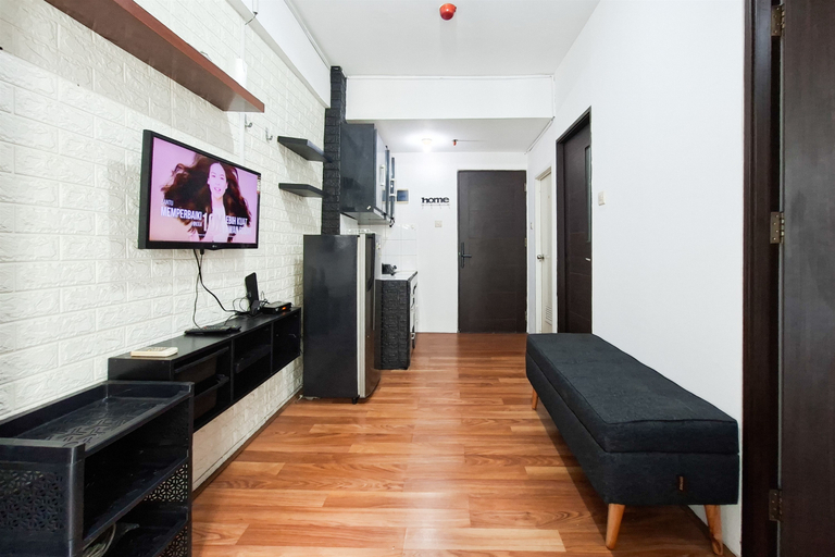 Living Room 2, Pleasant and Airy 2BR at Apartment Sky View By Travelio, Tangerang Selatan