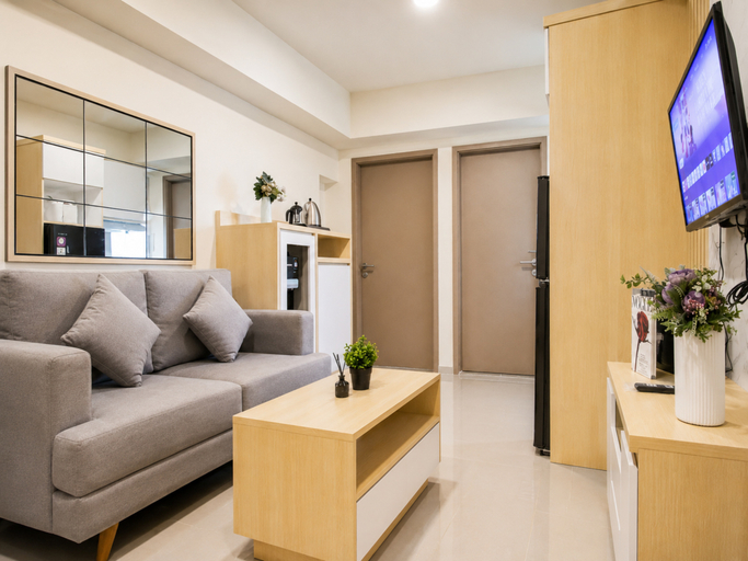 Living Room 3, Modern Warm 2BR at Apartment Meikarta District 2 By Travelio, Cikarang