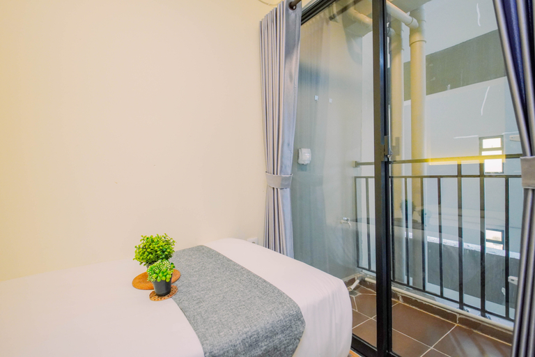 Bedroom 4, Bright and Modern 2BR at Apartment Meikarta District 2 By Travelio, Cikarang