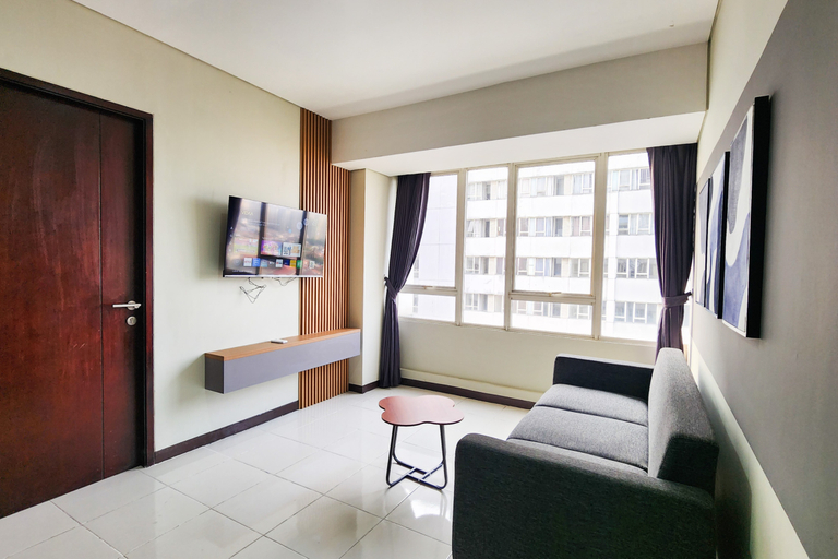 Living Room 4, Tastefully Designed 3BR at Apartment Nifarro Park By Travelio, Jakarta Selatan