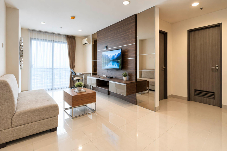 Living Room 4, Sleek and Minimalist 1BR at Apartment Praxis By Travelio, Surabaya