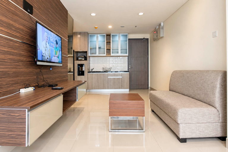 Living Room 3, Sleek and Minimalist 1BR at Apartment Praxis By Travelio, Surabaya