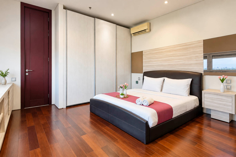 Bedroom 2, Spacious and Airy 3BR with Extra Room at Apartment Sumatra36 By Travelio, Surabaya