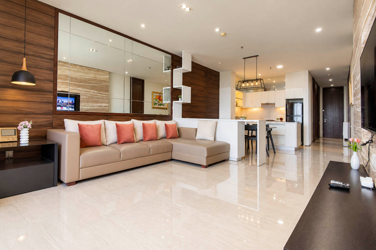 Living Room 5, Spacious and Airy 3BR with Extra Room at Apartment Sumatra36 By Travelio, Surabaya