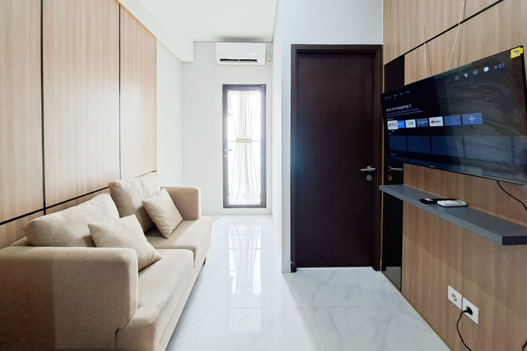 Living Room 3, Scenic and Homey 2BR at Apartment Transpark Bintaro By Travelio, South Tangerang