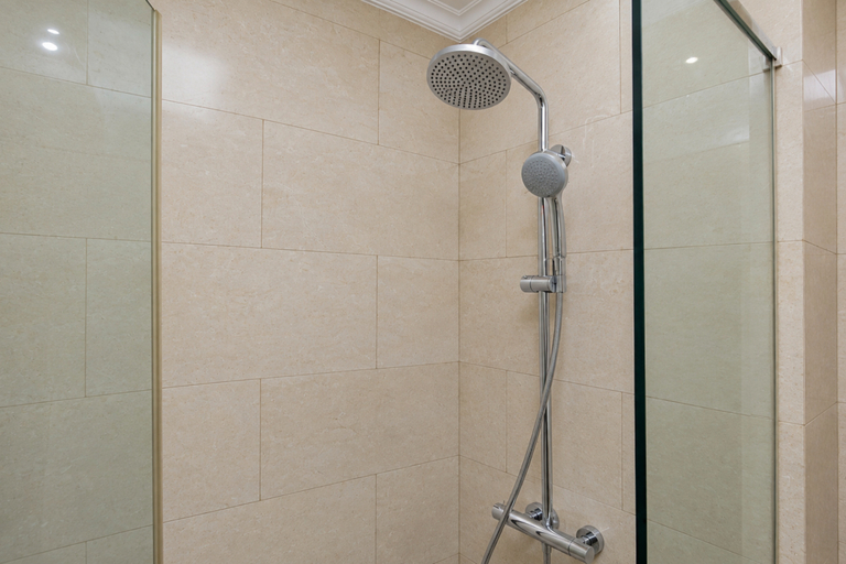 Bathroom 2, Smart and Stylish Studio at Apartment Menteng Park By Travelio, Central Jakarta