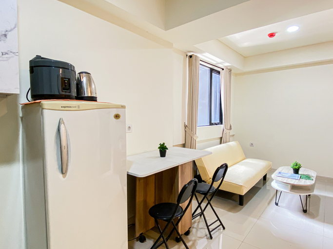 Living Room 4, Timeless Style 2BR at Apartment Meikarta District 1 By Travelio, Cikarang