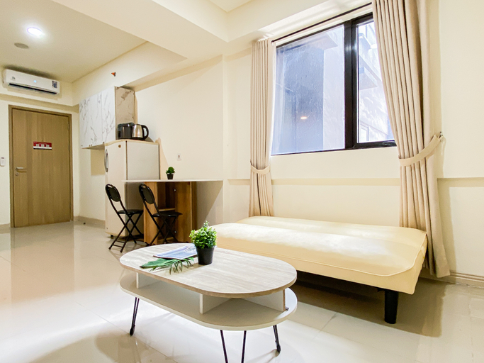 Living Room 2, Timeless Style 2BR at Apartment Meikarta District 1 By Travelio, Cikarang