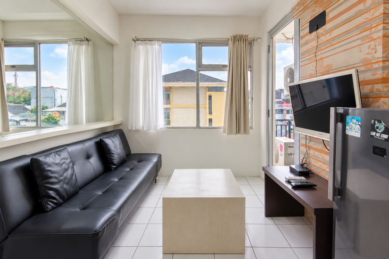 Living Room 3, Modern and Bright 2BR at Apartment Jarrdin Cihampelas By Travelio, Bandung