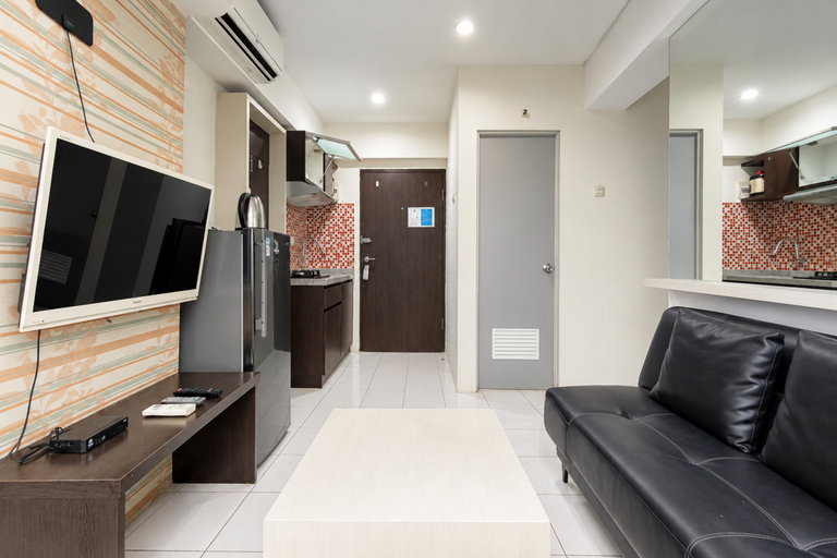 Living Room 4, Modern and Bright 2BR at Apartment Jarrdin Cihampelas By Travelio, Bandung