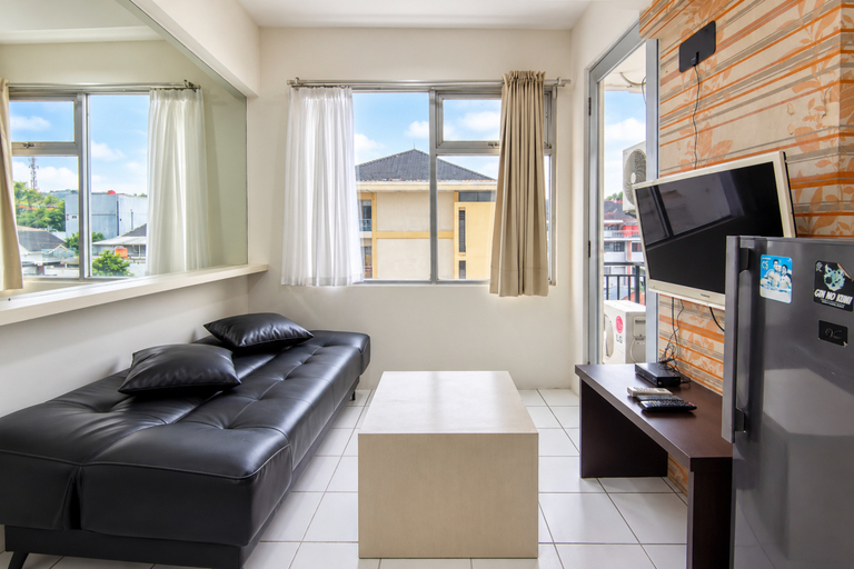 Living Room 5, Modern and Bright 2BR at Apartment Jarrdin Cihampelas By Travelio, Bandung