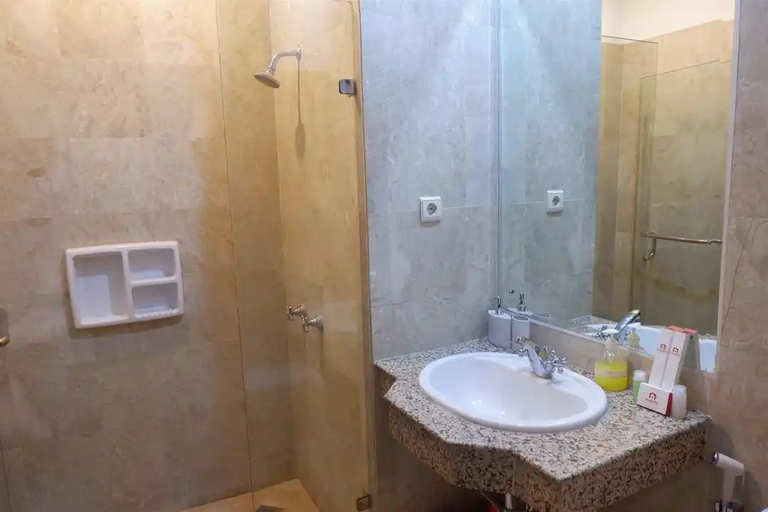 Bathroom, Homey Warm 1BR at Ambassade Residence By Travelio, South Jakarta