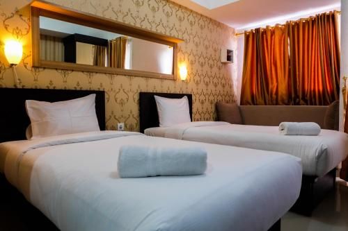 Minimalist Studio The Oasis Apartment near Omni Hospital Cikarang By Travelio, Cikarang