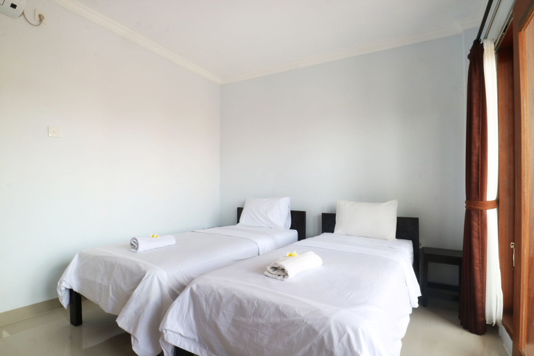 The Wina Echo Beach Guesthouse - Tap to explore photos