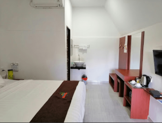 Madu Tiga Beach & Resort - Tap to explore photos