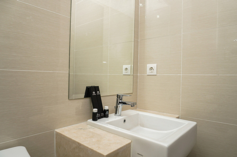 Minimalist Studio Room at Puri Mansion Apartment By Travelio, West Jakarta
