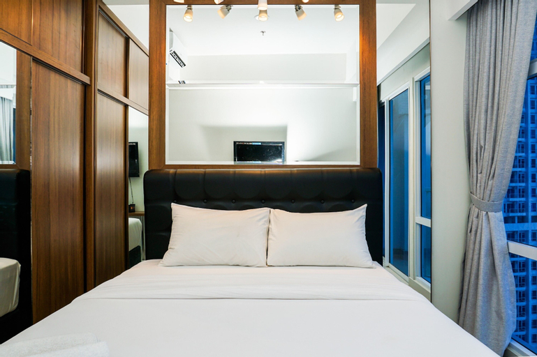 Minimalist Studio Room at Puri Mansion Apartment By Travelio, West Jakarta