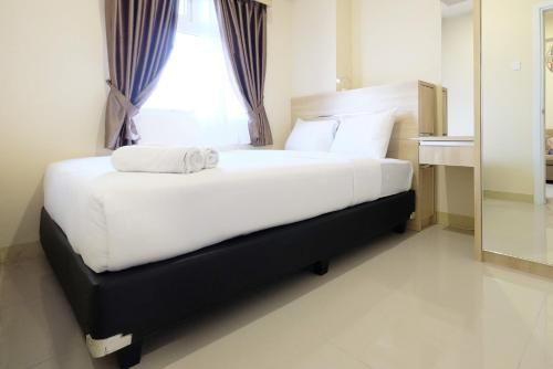 Clean And Tidy 2BR Green Pramuka Apartement By Travelio, East Jakarta