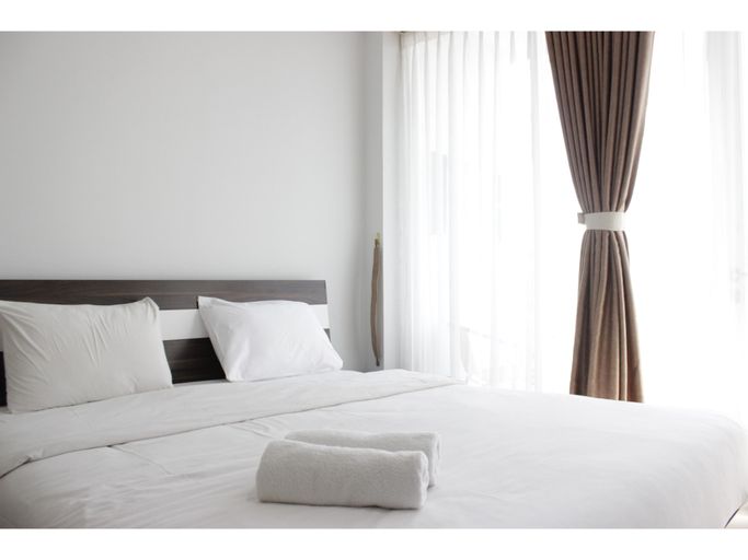 Pleasant 1BR Apartment with Sofa Bed at Dago Suites By Travelio, Bandung