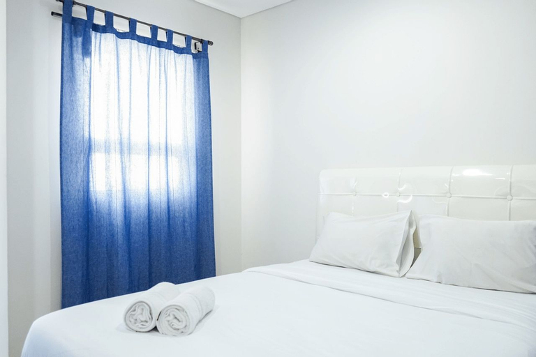 Bedroom 1, Modern Living 1BR @Atlanta Residences Apartment With City View By Travelio, Depok
