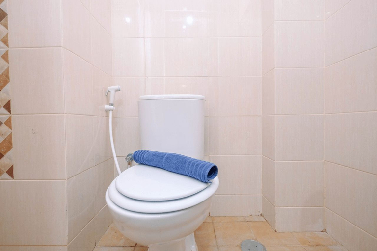 Bedroom 5, Minimalist and Comfy Studio Dave Apartment By Travelio, Depok