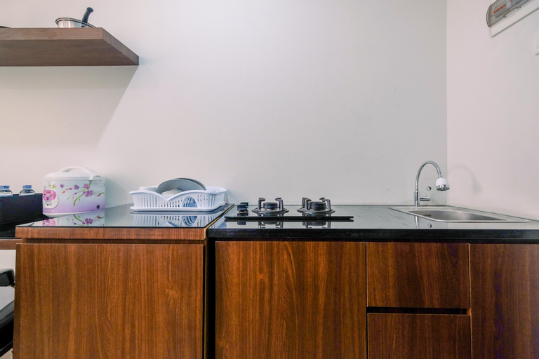 Elegant with Modern Design 1BR Apartment at Atlanta Residences By Travelio, Depok