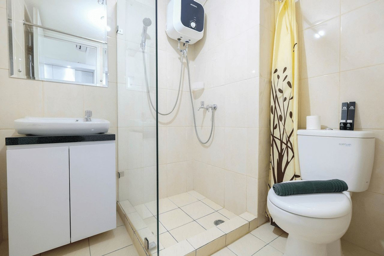 Bedroom 3, Modern White Studio at Springlake Summarecon Bekasi Apartment By Travelio, Bekasi