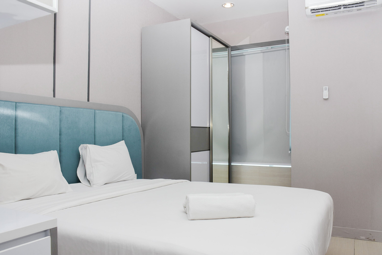 Bedroom 1, Modern and Comfortable Studio at Grand Kamala Lagoon Apartment By Travelio, Bekasi