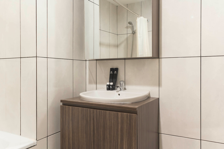 Bedroom 4, Chic and Cozy 2BR Grand Kamala Lagoon Apartment By Travelio, Bekasi