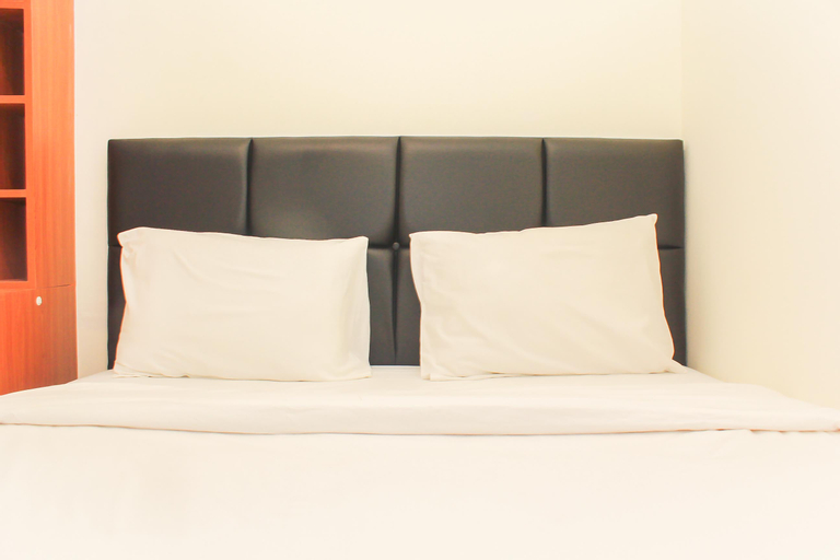 Bedroom 1, Nice and Comfort 2BR at Meikarta Apartment By Travelio, Cikarang