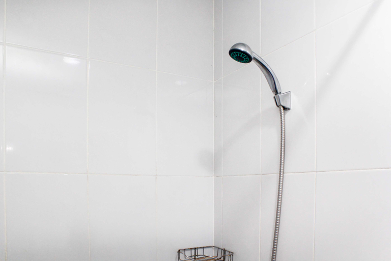 Bathroom 5, Comfortable and Simply Studio Apartment at Patraland Urbano By Travelio, Bekasi