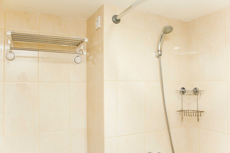 Bathroom 5, Comfort and Minimalist Studio at Springlake Summarecon Bekasi Apartment By Travelio, Bekasi
