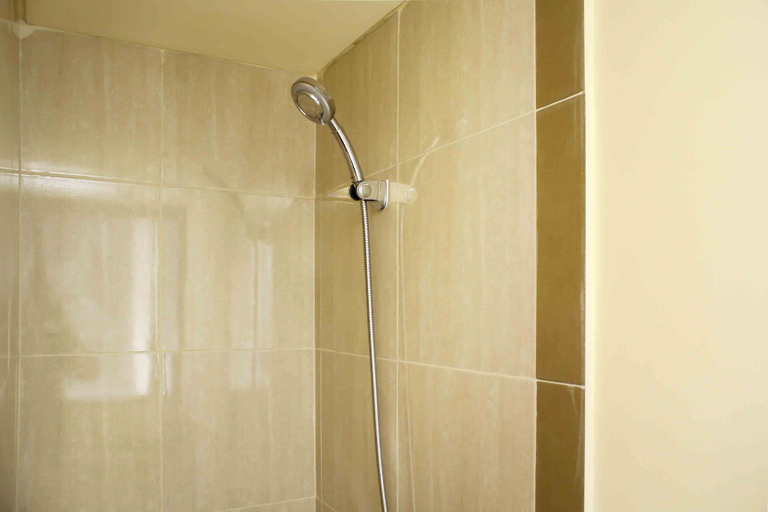 Bathroom 5, Comfort and Serene 2BR at Meikarta Apartment By Travelio, Cikarang