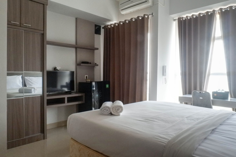 Exclusive and Comfy Studio Room Apartment at Taman Melati Surabaya By Travelio, Surabaya