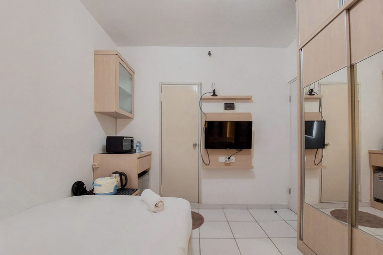 Bedroom 2, Cozy and Minimalist Studio (No Kitchen) at Aeropolis Apartment By Travelio, Tangerang