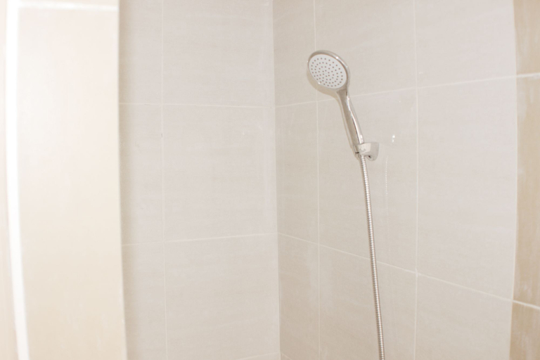 Bathroom 5, Serene and Cozy 2BR at Meikarta Apartment By Travelio, Cikarang