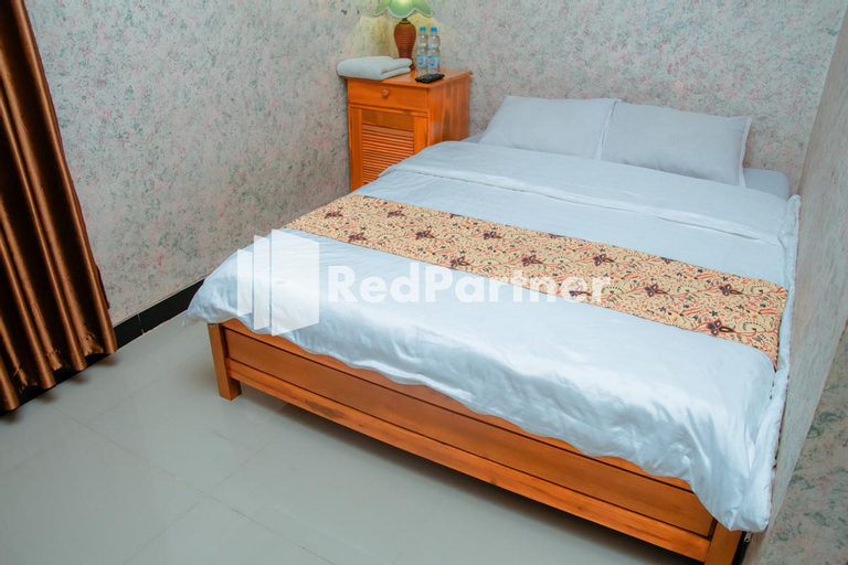 Bedroom 4, Flamboyan Asri Syariah Mitra RedDoorz near Kampung Inggris Pare, Kediri